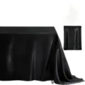 Black satin tablecloth detail showing smooth glossy fabric texture for wedding banquet decor. - Black