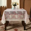 Detailed close-up of pastoral lace embroidered tablecloth showing transparent floral design. - 100*150 cm / Pink Money Flower