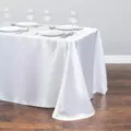 White satin tablecloth for wedding banquet and party, elegant rectangular fabric table cover. - 145x145 cm / White