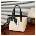 Chic straw tote bag for women with black PU trim and stylish scarf accent. Perfect summer crossbody. - Black and White