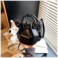 Black patent leather bucket bag with cute bear pendant, stylish casual shoulder crossbody bag. - With Pendant / Black
