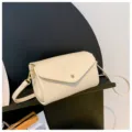 Chic minimalist cream crossbody bag with gold hardware for women casual daily wear. - Beige