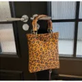 Leopard print canvas handbag with bamboo handle retro casual shoulder bag for women commuter - Brown