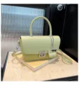 Green women's shoulder crossbody bag, vintage commuter handbag with top handle and charm. - Green