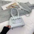 Light blue women handbag PU leather shoulder crossbody bag with top handle and metal bottom studs - Blue Without Charm