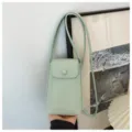 Light green leather crossbody phone bag, mini vertical shoulder bag with front pocket. - Green
