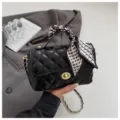 Chic black quilted chain shoulder crossbody bag featuring a stylish geometric silk scarf detail. - Black