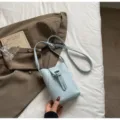 Light blue mini bucket crossbody bag, compact PU leather vertical mobile phone bag for daily. - No Pendant / Blue