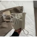 Mini white PU leather crossbody phone bag with pearl bow pendant for women daily commute. - Pearl Pendant / White