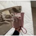 Pink PU leather mini bucket phone bag with elegant pearl lace bow and metal charm. - Pearl Pendant / Pink
