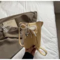 Yellow mini vertical phone bucket bag with pearl lace bow and heart pendant for daily commuting. - Pearl Pendant / Yellow
