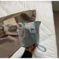 Mini light blue bucket bag for women, cute pearl bow phone crossbody bag for daily commute. - Pearl Pendant / Blue