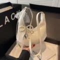 White hobo shoulder bag for women, trendy dumpling bag with cute pearl bow and lace design. - With Pendant / White