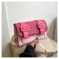 Pink and black color-blocked satchel bag with straw weave texture and stylish double buckles. - Pink