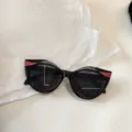 Details der modischen Katzenauge Glitzer Kinder Sonnenbrille, schwarzer Rahmen mit Glitzer. - Schwarz