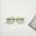 Trendy kids sunglasses with one-piece square frame and green lenses for outdoor travel. - Green