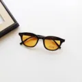Children sunglasses detail view, classic retro frame with yellow UV400 protection lens. - Black Orange