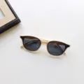 Fashion kids sunglasses with trendy rivet frame design, offering UV400 protection for children. - Off White