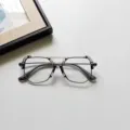 Vue détaillée de lunettes de mode pour enfants en gelée transparente à cadre carré irrégulier. - Monture Gris Transparent Verre Clair