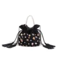 Black velvet rhinestone bucket bag detail, luxury pearl handle and crystal embellishments. - Black