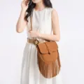 Brown faux suede fringe crossbody bag, retro western style single shoulder bag variant. - Tan