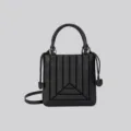 Elegant black leather top handle crossbody bag featuring unique vertical geometric design. - Black