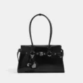 Bolso de hombro de charol negro para mujer, elegante bolso de moto con colgante de corazón. - Negro