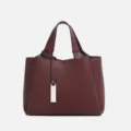 Burgundy leather women handbag variant, stylish top handle shoulder bag with metal pendant. - Burgundy