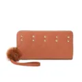 Brown long wallet with quilted pattern, metal studs, wrist strap and cute furry pom-pom. - Tan
