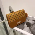 Mini clover print women clutch wallet, stylish brown leather coin purse with furry ball charm. - Tan