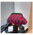 Knitted wavy clutch bag for women, stylish pink and green striped pattern with metal chain strap. - Green