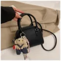 Korean minimalist black dome crossbody bag with cute teddy bear pendant variant view. - With Pendant / Black