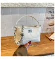 White quilted bucket bag with chain strap and top handle, elegant commuter shoulder handbag. - No Pendant / White
