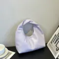 Stilvolle violette Damen Handtasche, trendige gedrehte Griff Wolkentasche mit minimalistischem Design. - Lila