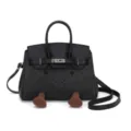 Close-up detail of the cute denim patchwork Kelly handbag featuring a playful smile and feet. - Black