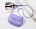 Purple PU leather saddle bag for women, stylish crossbody phone bag with adjustable thin strap. - Light Purple