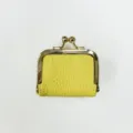 Detailed close-up view of mini yellow textured leather kiss-lock coin purse with gold metal frame. - 6.5*3.4*4.5 / Yellow
