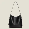 Minimalist black PU leather bucket bag, large capacity soft tote for women daily commute. - Black