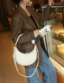 Stylish white crescent hobo bag for women, premium leather shoulder and crossbody purse detail. - Off White
