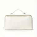 White leather cosmetic bag with top handle and gold zipper for travel and storage. - 25x12x13cm / White