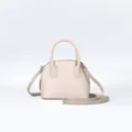 Elegant beige dome handbag with top handles and adjustable crossbody strap for daily casual wear. - 18x9x15cm / Beige