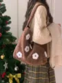 Brown plush flower embroidered bucket bag detail shot showing autumn winter aesthetic style. - Brown