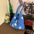 Blue fuzzy floral embroidered bucket bag, cozy knitted tote handbag for women commuting daily. - Blue