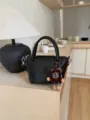 Classic black leather handbag for women, stylish tote bag with top handle and cute keychain. - With Charm / 18x10x13cm / Black