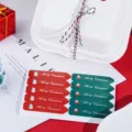Close-up detail of Christmas gift wrapping stickers with cute snowman and Santa Claus designs. - Christmas Long Sticker / 10 Pieces