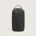 Black minimalist waterproof PU storage bag, portable travel organizer, multi-compartment design. - Black