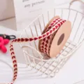 Detailed shot of the red heart fabric ribbon inside a white wire basket, ideal for gifts. - 1cm Wide * 9m