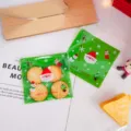 Weihnachtskekse und Suesswaren Verpackungsbeutel Detailansicht, gruene Geschenktueten. - Grüner Weihnachtsmann / 100er Pack