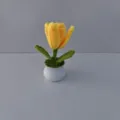 Handmade crochet yellow tulip potted plant detail, showcasing cute knitted floral home decor. - Yellow