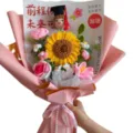 Handcrafted crochet sunflower graduation bouquet with cute doll, perfect gift for students. - Winning the Top Prize